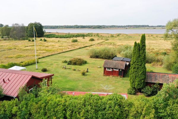 Bild 4 på Sjötomt med privat brygga, roddbåt & solnedgång