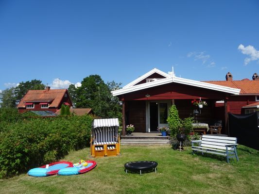 Mysig timmerstuga vid Siljans strand